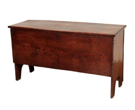 AN OAK COFFER, 19th century, with rectangular hinged top with notched ends, the single front panel with notched ends, 56.5 cm