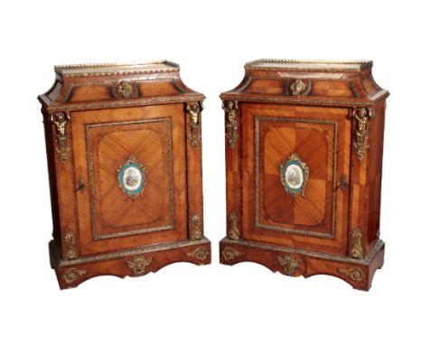 A PAIR OF KINGWOOD AND TULIPWOOD VENEERED AND GILT METAL MOUNTED SIDE CABINETS IN LOUIS XV /XVI TRANSITIONAL STYLE,, each wit