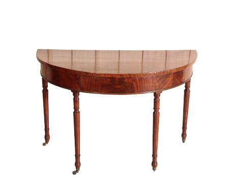 A MAHOGANY D-SHAPED SIDE TABLE, first half 19th century, the D-shaped top above a plain frieze, on turned baluster legs with 