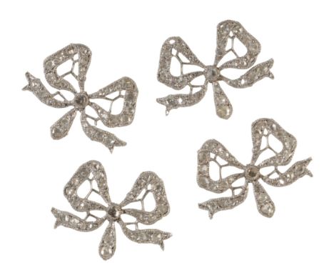 A SET OF FOUR DIAMOND DRESS BOWS, each bow milligrain diamond set, on unmarked white metal, each 20mm x 15mm,