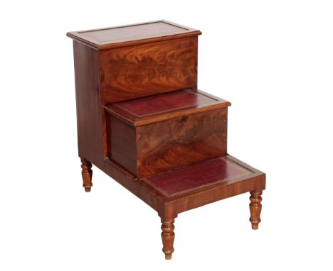 A VICTORIAN MAHOGANY STEP COMMODE,, circa 1870, with three red leather treads, the middle drawer opening as the commode, on t
