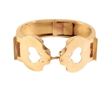 A YELLOW GOLD HINGED BANGLE, unmarked but tests as gold, approx 37.8 grams