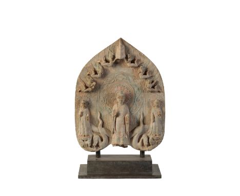 INDIAN SCUPLTED AND PAINTED LIMESTONE BUDDHISTIC FIGURAL PANEL, on a stepped bas, 56cm high overall