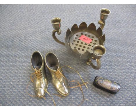 A Georgian papiermache snuff box containing a miniature model of a young boy in cast metal, together with a pair of ornamenta