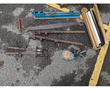 Vintage woodworking tools and other items to include sash cramps, Black and Decker, a two-handled saw and a screen 