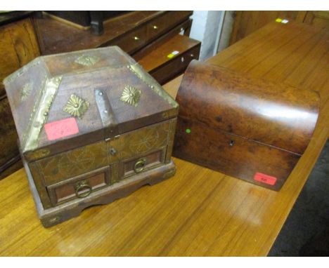 A 19th century walnut tea caddy with domed lid and fitted interior, and an Indian/Asian wooden jewellery casket with stamped 