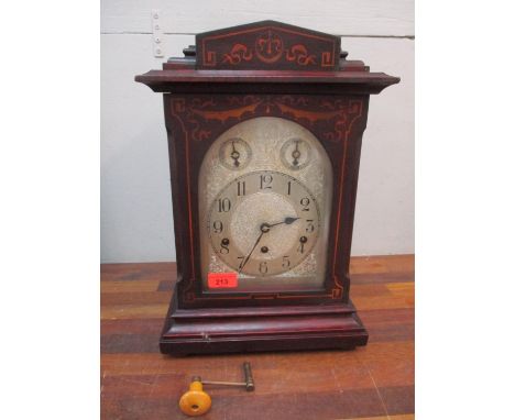 A 19th century inlaid mahogany bracket style mantle clock, the Keenzle movement striking on Westminster chimes (with a key an