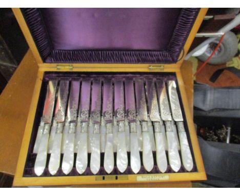 A Victorian cased set of Maple &amp; Co fruit knives and forks with mother of pearl handles and engraved blades 