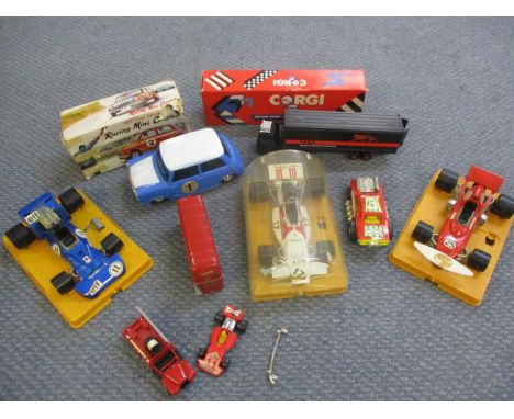 A collection of vintage model cars to include a friction-drive racing Mini Cooper in original box, and a Corgi diecast Seddon