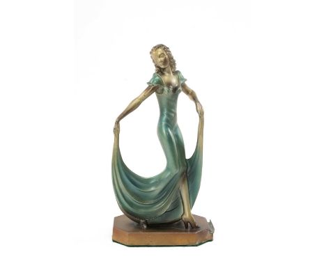 ART DECO PATINATED SPELTER FIGURAL TABLE LIGHTER, modelled as a stylish dancer in evening gown, on shaped plinth base, 23cms 