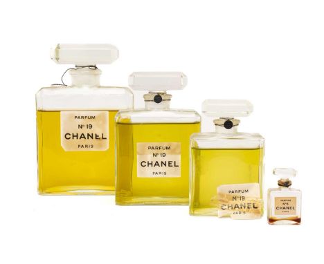 VINTAGE PERFUME comprising three graduated glass bottles of 'Chanel No 19 Parfum Paris' with contents, together with a miniat