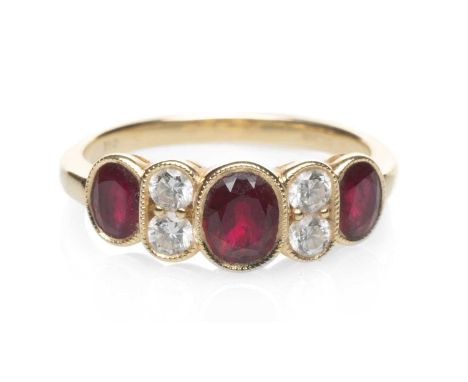 18CT GOLD RUBY & DIAMOND SEVEN STONE RING, ring size L, 3.1gmsProvenance: Torfaen County Borough Comments: good overall, ligh