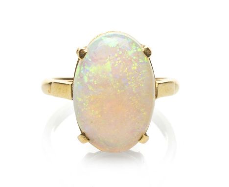 18CT GOLD OPAL RING, the claw set oval opal measuring 16 x 11mms approx., ring size N, 5.0gms in Howell's of Haverforwest rin