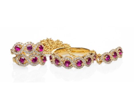 18CT GOLD RUBY & DIAMOND JEWELLERY comprising ring, pair of earrings, pendant on chain, stamped 'Pravins' and '750', 11.8gms 