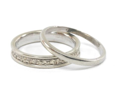 TWO 18CT WHITE GOLD WEDDING BANDS, one plain, stamped '18' and hallmarked for London 1930, ring size Q, the other with textur