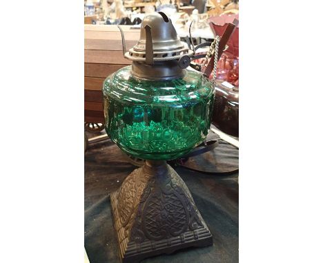 A decorative paraffin lamp with cast iron base. Not available for in-house P&amp;P, contact Paul O'Hea at Mailboxes on 01925 