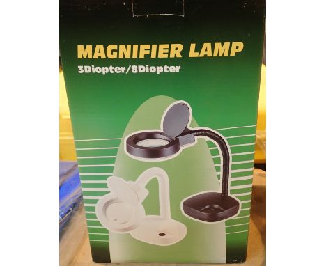 New and boxed illuminating magnifier lamp. P&amp;P Group 2 (£18+VAT for the first lot and £3+VAT for subsequent lots) 