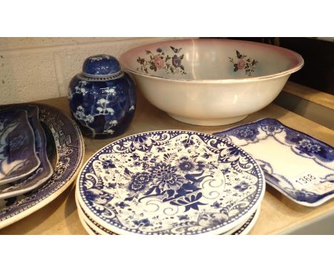 A selection of decoratively patterned blue and white ceramic plates and a large ceramic wash bowl. Not available for in-house