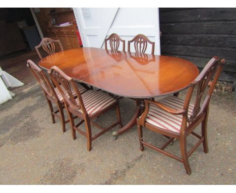 Extending veneered double pedestal dining table with 6 upholstered chairs 