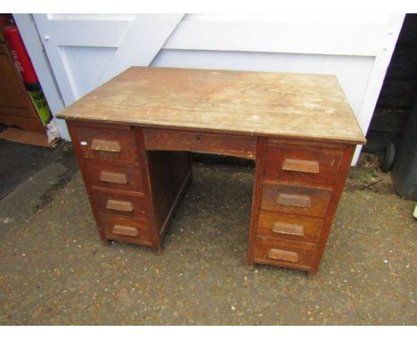 Vintage Oak pedestal desk with hidden central drawer flanked by 4 drawers each side H73cm W107cm D68cm approx