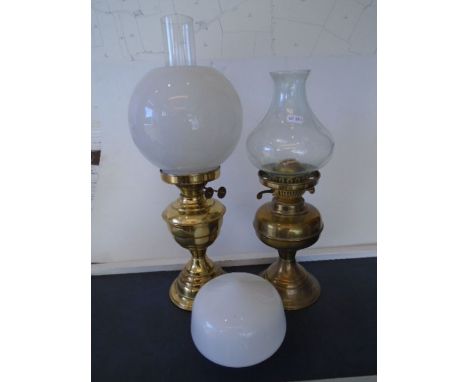 Brass oil lamp with opal white shade plus one other brass lamp and white glass shade