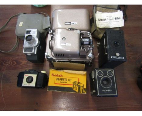A collection of vintage camera's and a projector