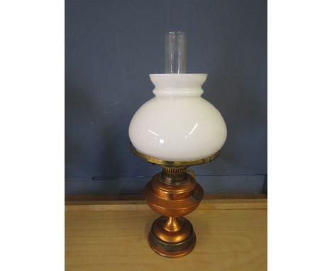 Brass base oil lamp with white glass shade and funnel