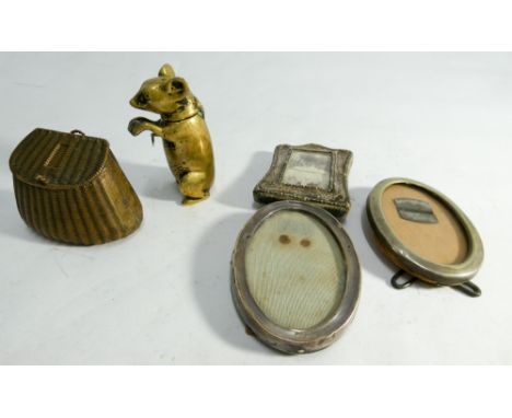 Two vintage brass vesta's one modelled as a mouse the other as a fishing creel and three miniature photograph frames one of w