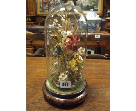 A 1930's vintage silk wedding bouquet beneath glass dome. Glass dome height with base 18cm.   No obvious sign of damage or re