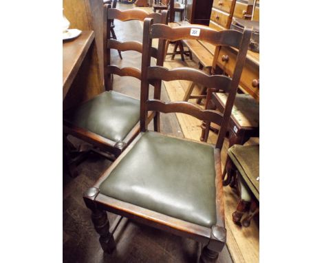 Set of four oak ladder back dining chairs on turned legs