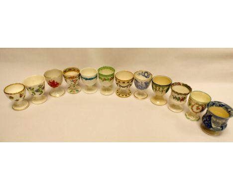 12 collectable ceramic egg cups by Herend, Doulton, Worcester etc 