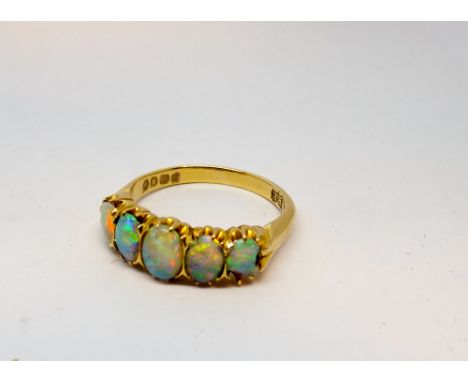 Victorian 18ct gold five stone opal ring in a carved setting, fully hallmarked