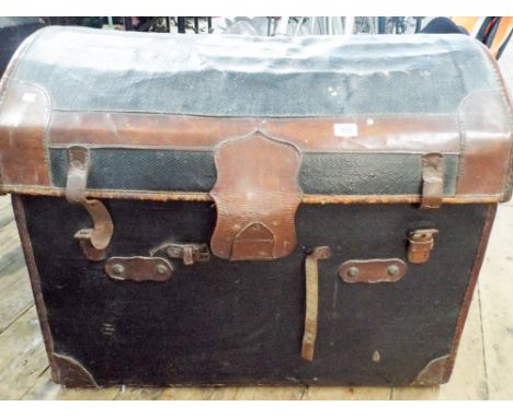 A dome top leather effect trunk