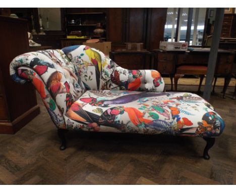 Modern chaise longue upholstered in parrot and butterfly print fabric together with two cushions by Kristjana S Williams
