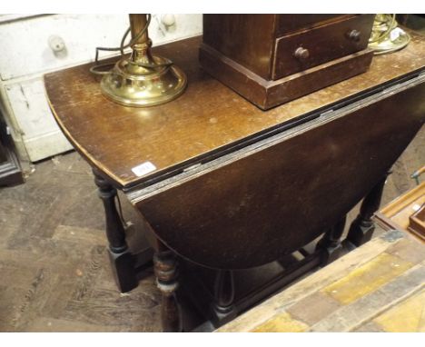 3' oval oak gate legged dining table on turned legs 