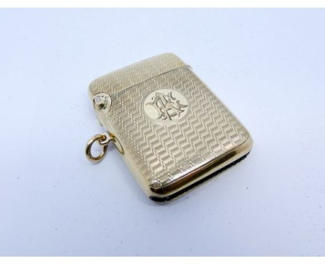 A 9ct yellow gold engine turned Vesta 23.7gms weight 