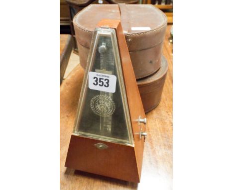 Metronome and two leather collar boxes with collars 
