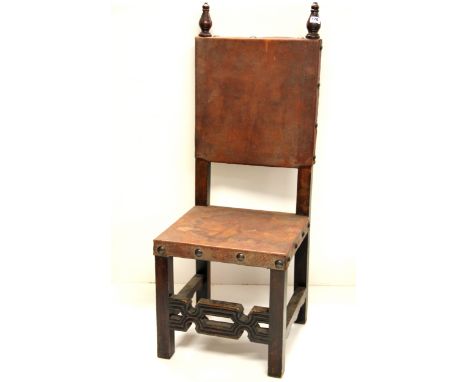 An early 20th Century carved oak and leather arts and crafts chair, Prov. Francis Bacon estate with photograph of the artist 