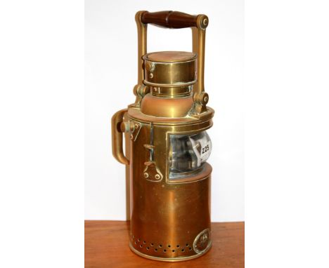 A Ratcliffe &amp; Sons brass railway signalling lamp, H. 41cm.