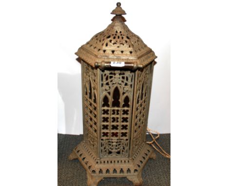 A cast iron and red glass floor lantern, H. 65cm.