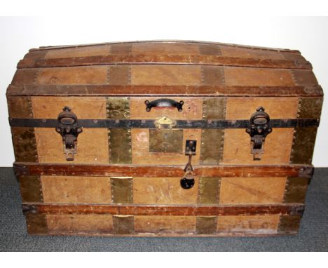 A large dome topped wooden cabin trunk, 93 x 50 x 60cm.