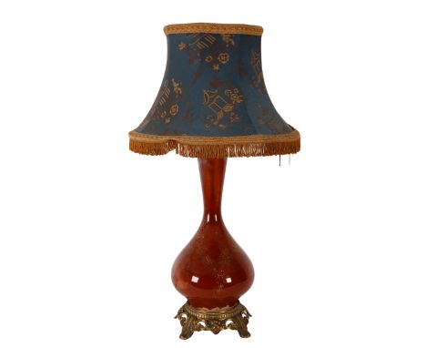 A 20TH CENTURY GLASS BALUSTER ELECTRIC TABLE LAMP with floral gilt printed and jewelled exterior, mottled brown painted inter