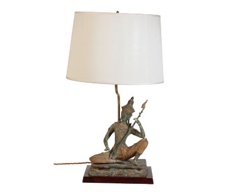 A SOUTH-EAST ASIAN PATINATED METAL FIGURE OF A MUSICIAN 20th century, converted to a table lamp, on a wooden base, the figure