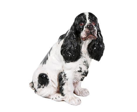 A LARGE CERAMIC SPANIEL 20th century, cast naturistically looking to the left, 54cm high 
