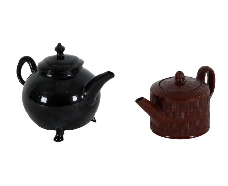 A JACKFIELD WARE TEAPOT AND COVER Staffordshire, Second-half 18th century, of globular form, with black glaze, 12cm high, tog