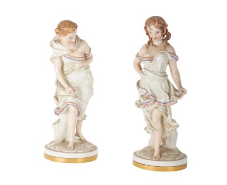A PAIR OF ROYAL WORCESTER PORCELAIN FIGURES modelled by James Hadley, depicting 'Before the wind' and 'Against the wind', the