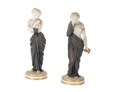A PAIR OF ROYAL WORCESTER PORCELAIN FIGURES DEPICTING JOY AND SORROW by James Hadley, each figure in coloured drapery, with g