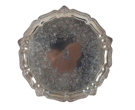 A VICTORIAN SILVER SALVER by R &amp; S Garrard &amp; Co, London, 1874, of circular lobed form, profusely decorated with flora