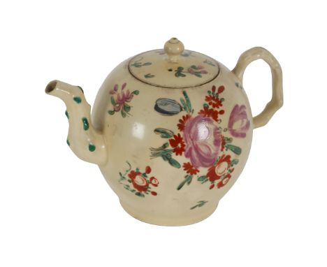 A CREAMWARE TEAPOT AND COVER Probably Cockpit Hill, Derby, Circa 1775, of ovoid form, decorated with floral sprigs, 14cm high