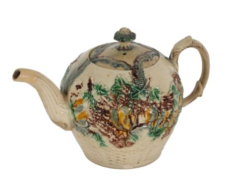 AN 18TH CENTURY TEAPOT AND COVER Of whieldon-type, probably Staffordshire, circa 1765, of globular form, profusely decorated 